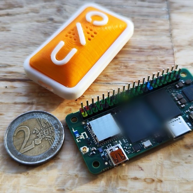 The ONU board and enclosure next to a 2-euro coin for scale